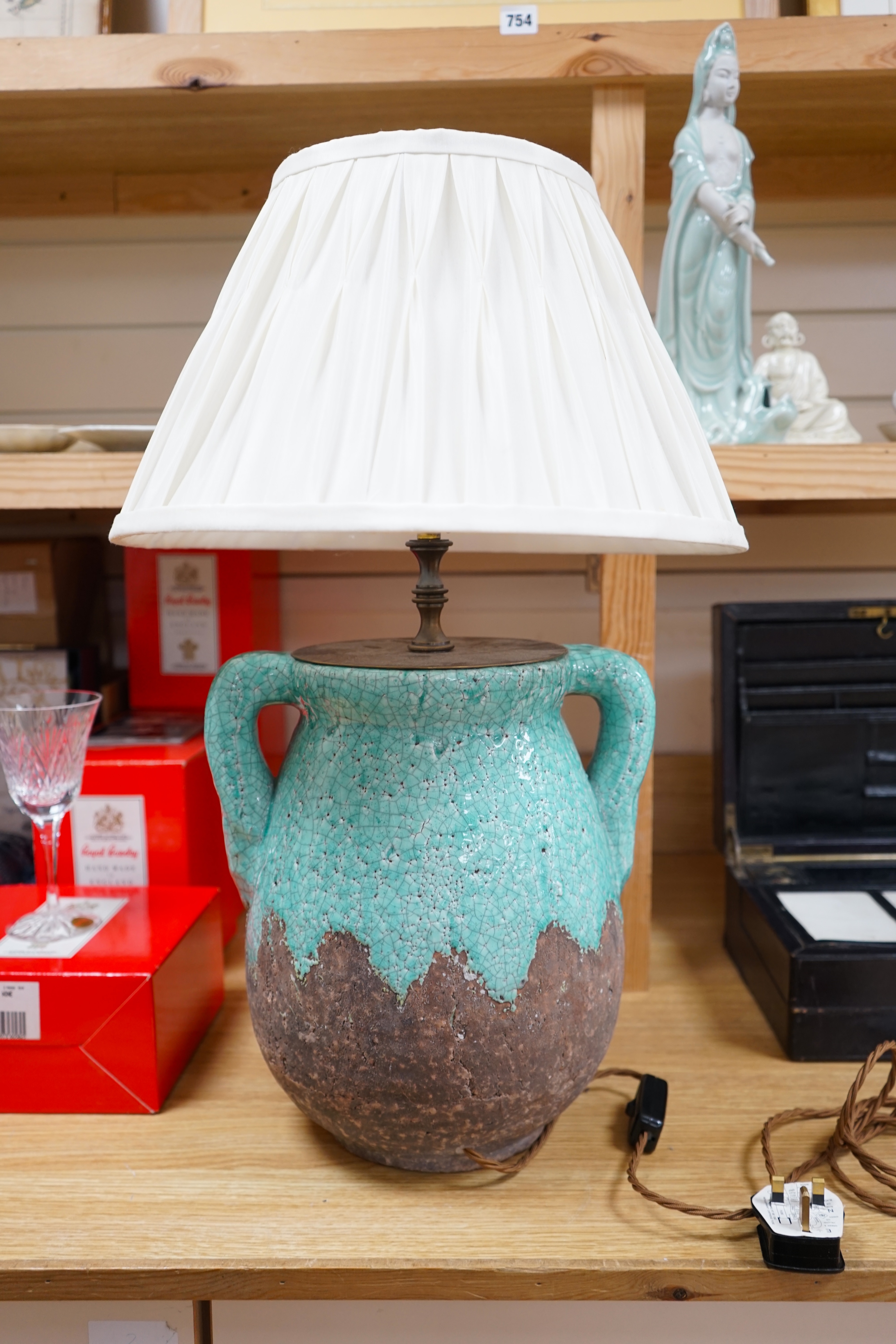 A turquoise lava ceramic table lamp with fabric shade, wired, 61cm to top of shade, 33cm high excluding the fitting and shade. Condition - good, untested